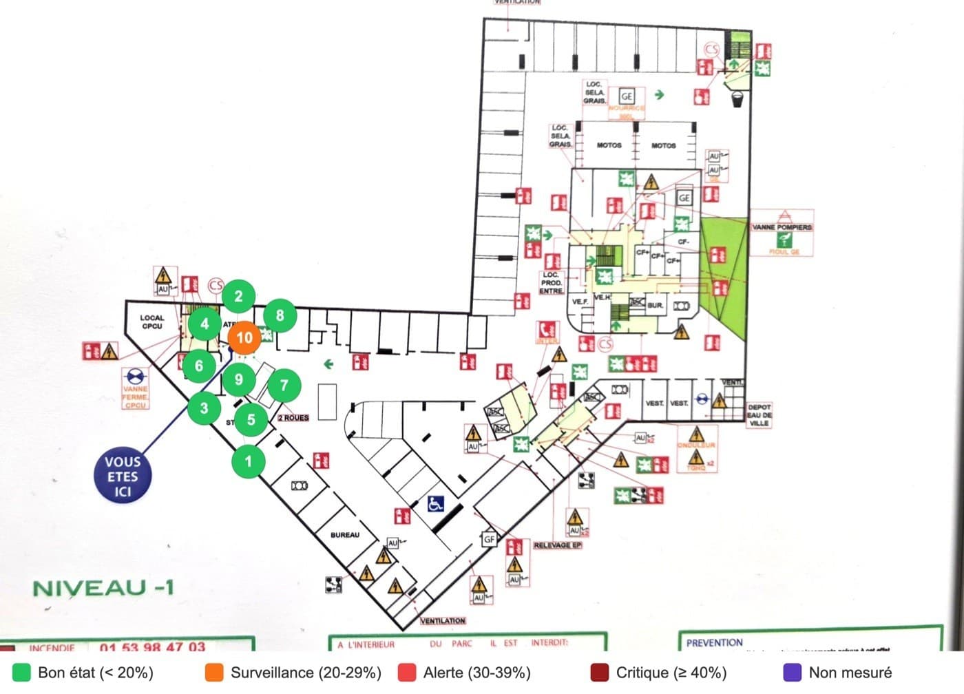 Plan du niveau -1 d'un bâtiment, annoté dans l'application : dix points de mesure numérotés, neuf verts et un orange, avec la légende des niveaux de corrosion.